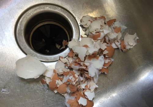 clogged kitchen sink - egg shells in drain