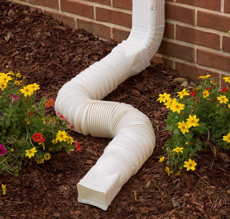 what causes basement flooding - downspout extensions