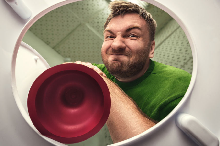 How-to-use-a-plunger-man-getting-aggressive-with-toilet-plunger.jpg