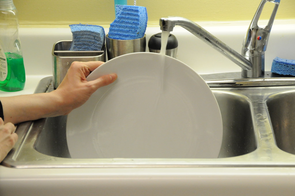 Rinse dishes before loading them into the dishwasher to prevent clogging