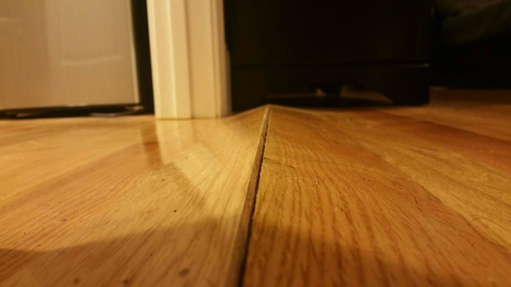 Warped floor due to hardwood floor water damage