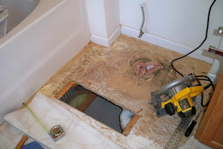 Cutting the flooring with a saw