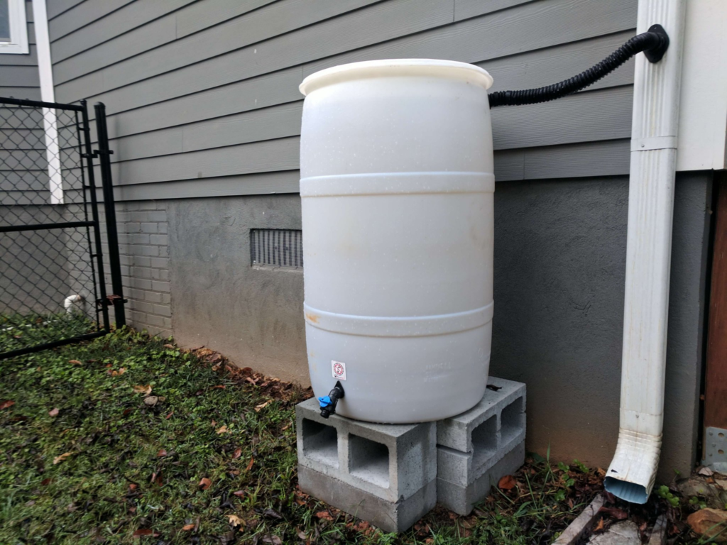 A rain barrel is a great way to conserve water at home. This can be used for your lawn, garden for your vegetables, and even your flowers. No need to turn on the water hose!