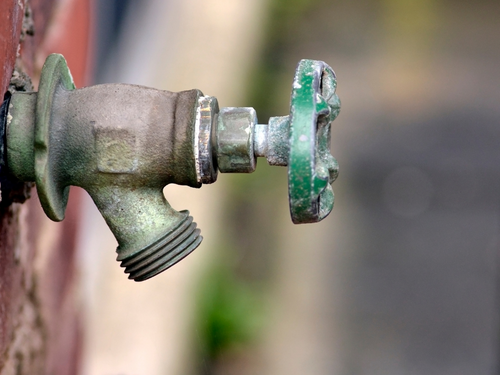 labor day plumbing advice - check hose spigot for leaks