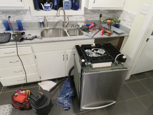 dishwasher being fixed