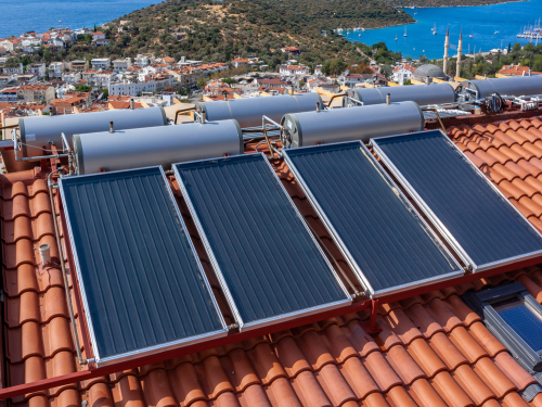 multiple solar water heaters on a roof